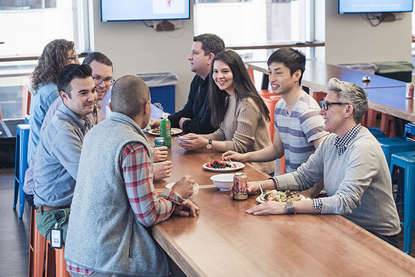 A group of Sift employees eating lunch together. 